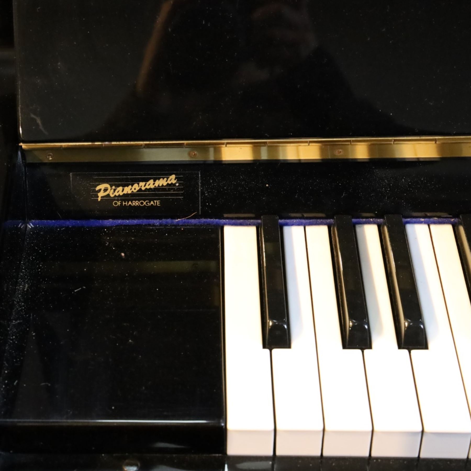 Offenbach by Daewoo model DU-4 upright piano, within high gloss ebonised case, circa 1990s serial no. 154804, with black wooden stool with velvet seat