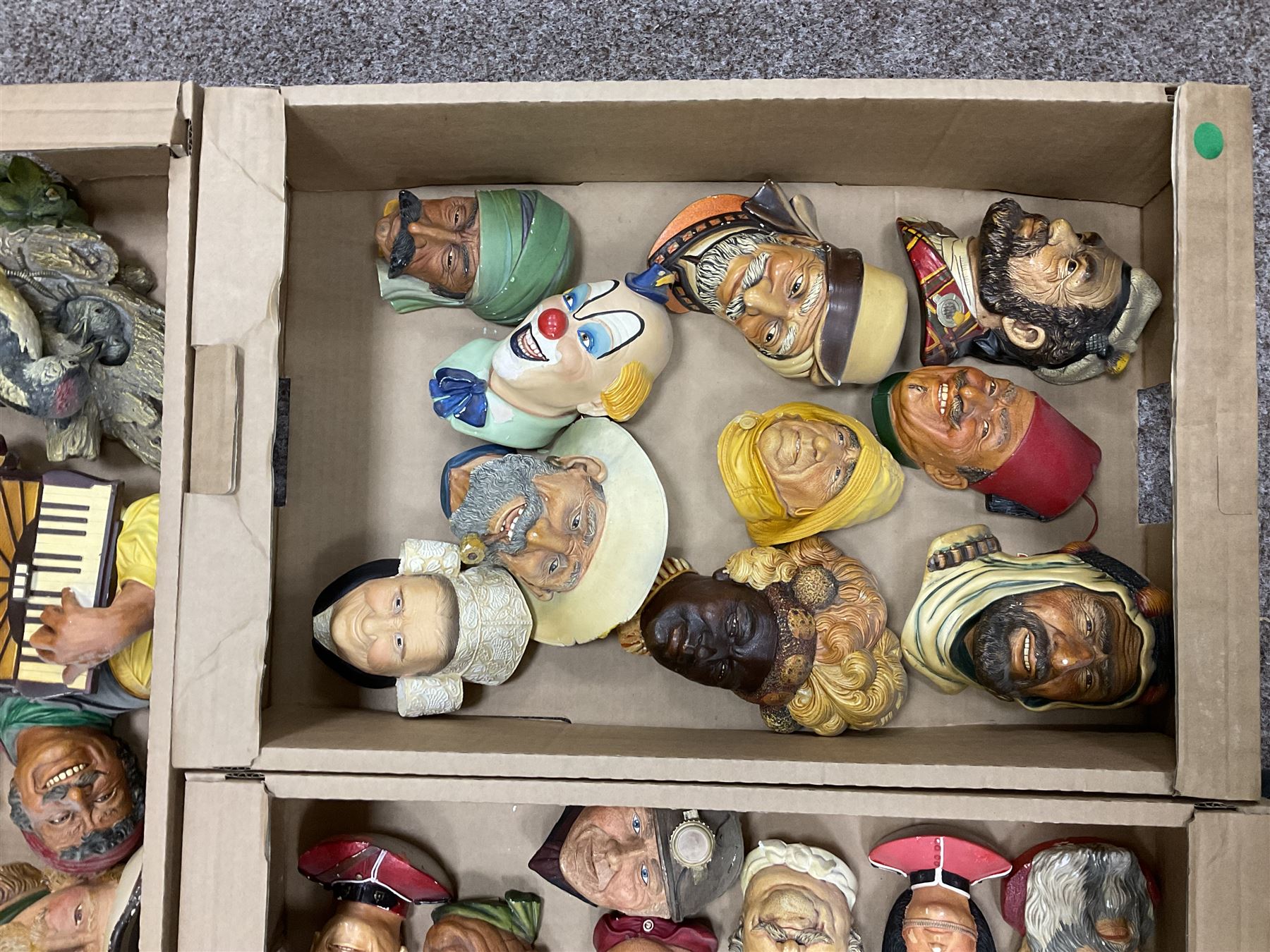Large collection of Bossons plaster wall-masks, including including fisher man, policeman, highway man, etc, in four boxes 