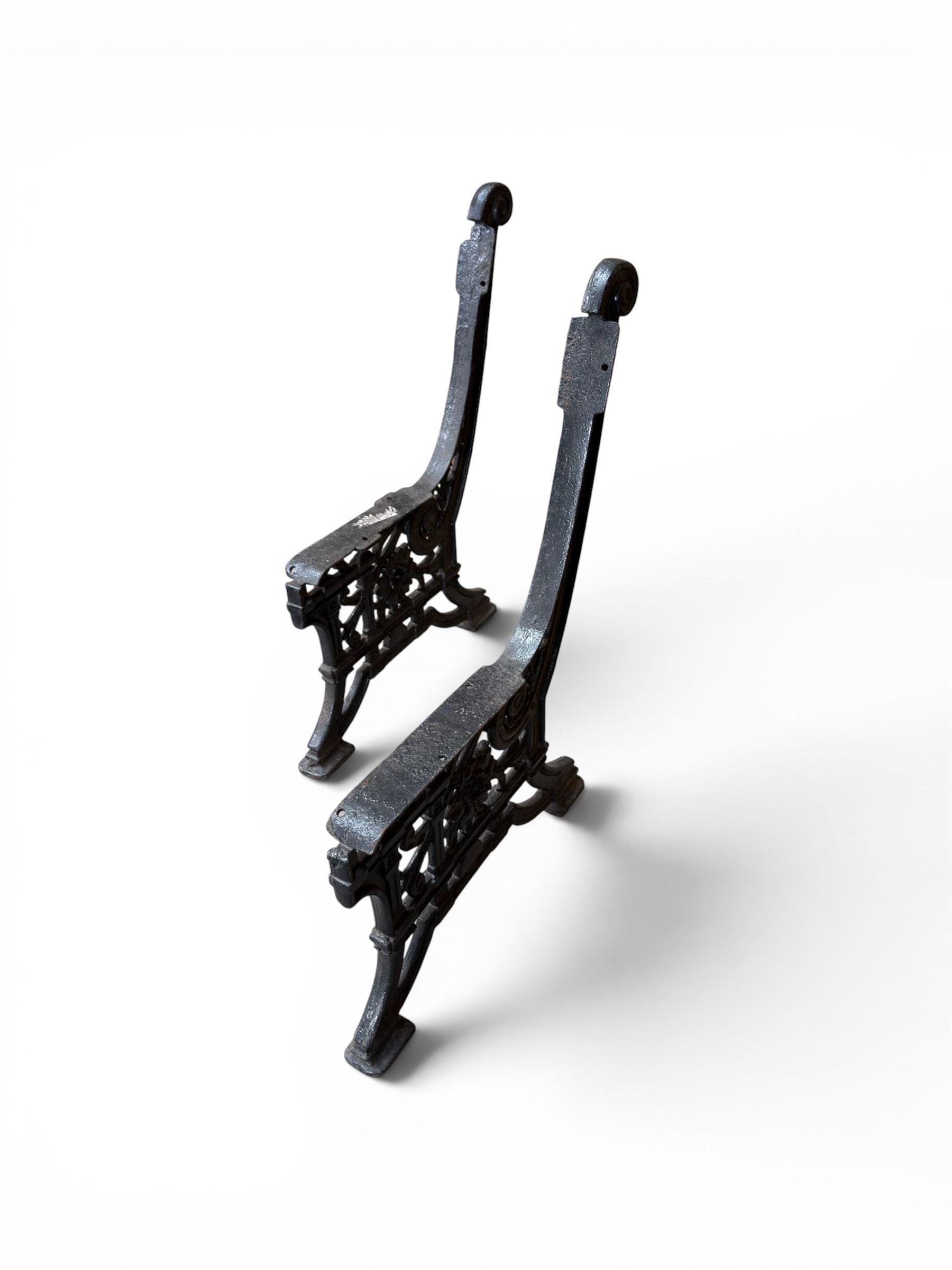 Yates Haywood - pair of Victorian cast iron bench ends, Architectural scrolling design with flower head detail, stamped with period registration number and date