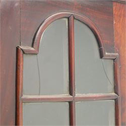 Late 19th century Continental bombe cabinet on chest, shaped moulded cornice with carved cresting, the upper section enclosed by a pair of arched glazed doors with astragal glazing revealing a shelved interior, the lower section fitted with four graduating drawers with rococo-style metal handles, serpentine front and sides, raised on scroll and paw feet