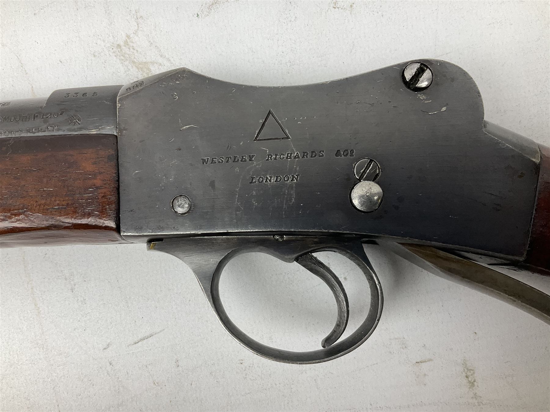 Westley Richards .310 Cadet Martini action rifle, the 63.5cm smooth bored barrel with one barrel band, walnut stock stamped 93/352 with hinged compartment to butt, serial no.3365, L103cm