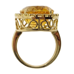  Large oval citrine and diamond cluster ring stamped 18K, citrine approx 20 carat, diamond total weight 0.7 carat  