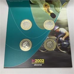 The Royal Mint Queen Elizabeth II 2002 Manchester Commonwealth Games four coin two pound coin set, in card folder