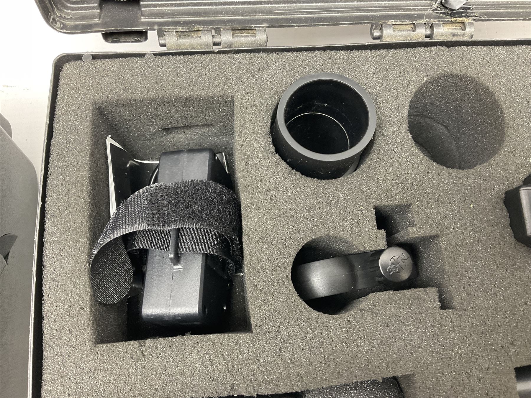 Two Nite-Site add-on kits in hard plastic carrying cases; one with charger