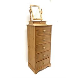Solid pine five drawer pedestal chest, shaped plinth base (W62cm, D45cm, H134cm), together with pine swing mirror