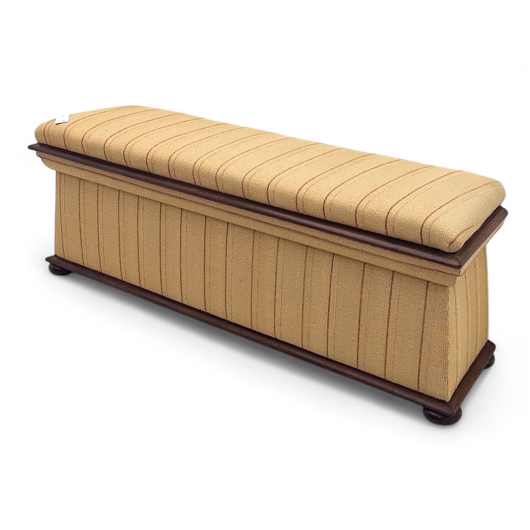 Late Victorian angular framed mahogany bay window seat, hinged lid with moulded upholstered padded seat, over upholstered front and sides, raised on compressed bun feet  