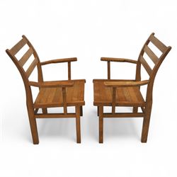 Treske of Thirsk - solid oak refectory dining suite, rectangular top with chamfered edge over trestle base united by a central stretcher, together with six matching slat back dining chairs, including two carvers, with panelled seats and square legs united by stretchers (H 87cm, W 62cm, D 57cm)