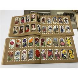 Two albums of cigarette cards, including Carreras Alice in Wonderland examples, together with vintage greetings cards, postcards, theatre stills, etc