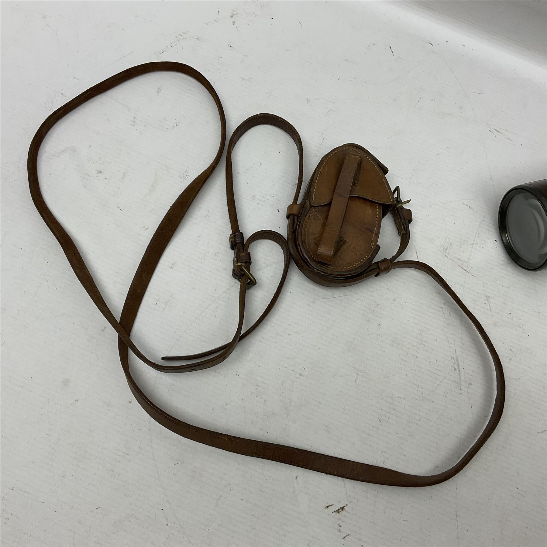 Broadhurst Clarkson brass and leather 4-draw telescope, the first draw with graduations, sliding lens shroud and leather covers for both ends on shoulder strap; marked 'Broadhurst Clarkson & Co. Ltd. 63 Farringdon Road London E.C.', L87cm fully extended; together with a WWI brass marching compass marked F-L No.123113 1918 (broad arrow); crudely etched L.H. McD. Latham; in associated Brooks & Co. leather case dated 1913 stamped W.B. Constable (2)