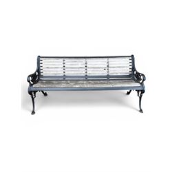 Victorian Andrew McLaren pattern cast iron bench, the ornate ends with detailed scrollwork, joined together with a cast iron seat and backrest frame supporting gently weathered oak slats, Victorian diamond stamp mark