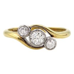 Early 20th century gold milgrain set three stone old cut diamond ring, stamped 18ct, total diamond weight approx 0.50 carat