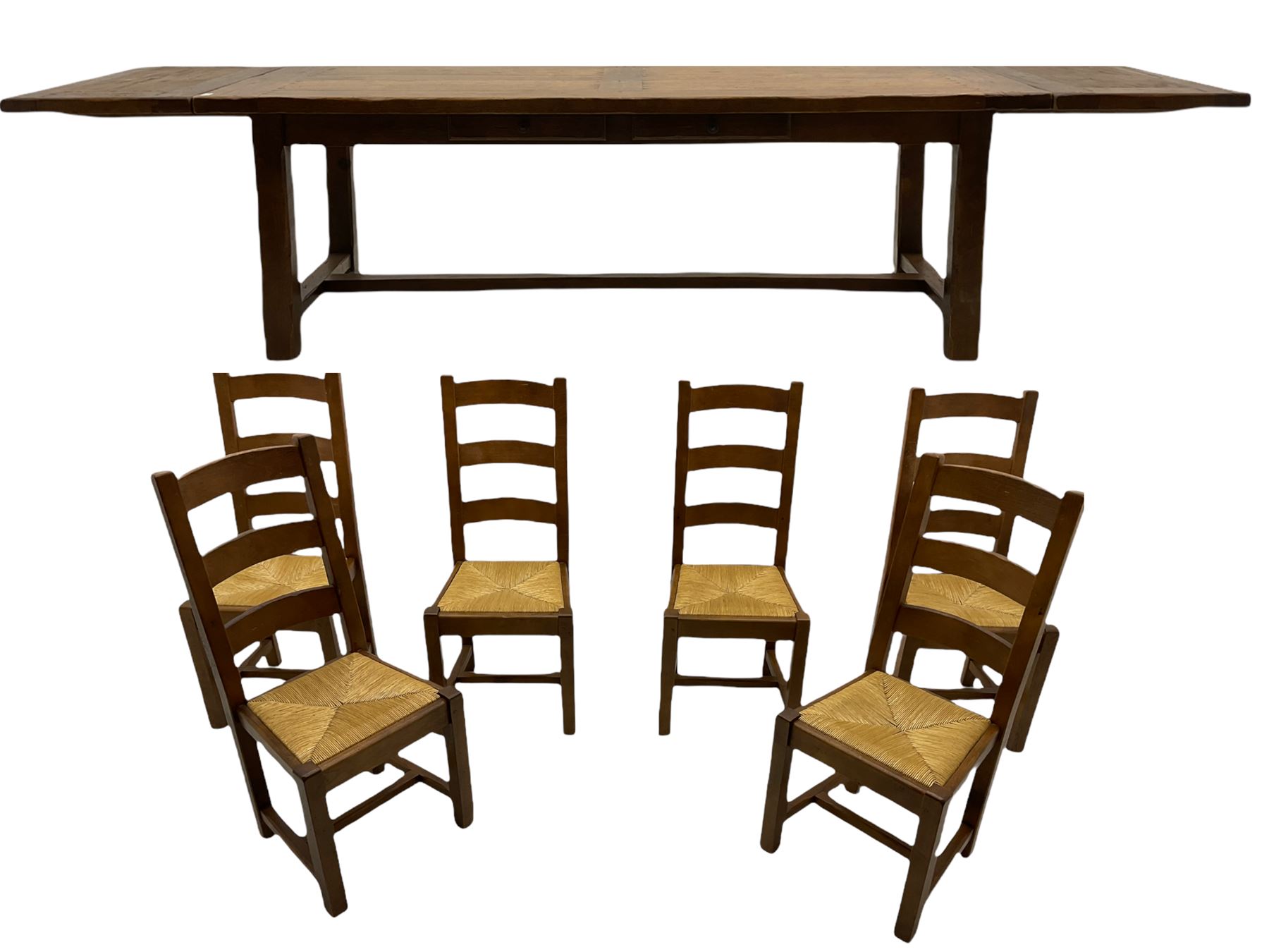 Antix French oak dining table with two leaves, two frieze drawers;, and six ladder back chairs with rush seats