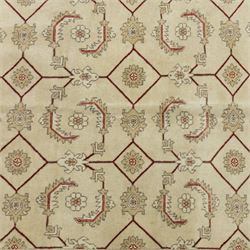 Baluchi signed hand-knotted rug, ivory ground, with an all-over geometric lattice design incorporating stylised flowerheads, hooked motifs and angular vine work, enclosed by a crimson border with repeating floral motifs and scrolling vines, flanked by narrow patterned guard stripes, signed to one corner, with cotton fringes