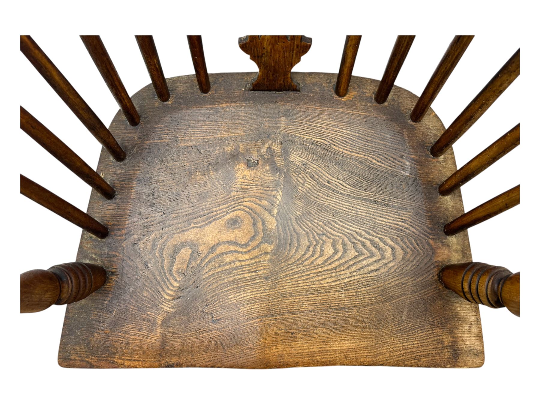 19th century provincial elm and beech Windsor armchair, shaped cresting rail over stick back with pierced and shaped splat, the dished seat on turned supports united by turned stretchers 