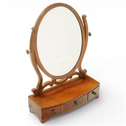 Two late 19th century mahogany toilet mirrors and a towel rail, one oval adjustable mirror on shaped uprights over a two-drawer base (H 73cm, W 48cm), the other with rectangular mirror plate on a hinged frame above a drawer base (H 44cm, W 37cm, D 17cm), together with a turned mahogany towel rail with arched top rail, double lower rails and splayed feet (H 81cm, W 65cm)