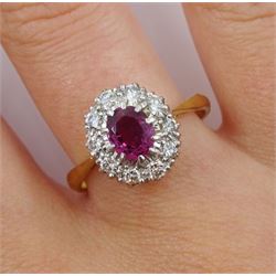 Gold oval ruby and diamond cluster ring, stamped 18ct