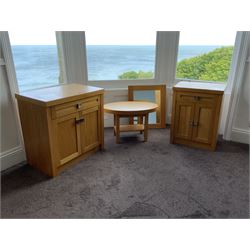 Two light oak side cabinets, oval table and wall mirror- LOT SUBJECT TO VAT ON THE HAMMER PRICE - To be collected by appointment from The Ambassador Hotel, 36-38 Esplanade, Scarborough YO11 2AY. ALL GOODS MUST BE REMOVED BY WEDNESDAY 15TH JUNE.