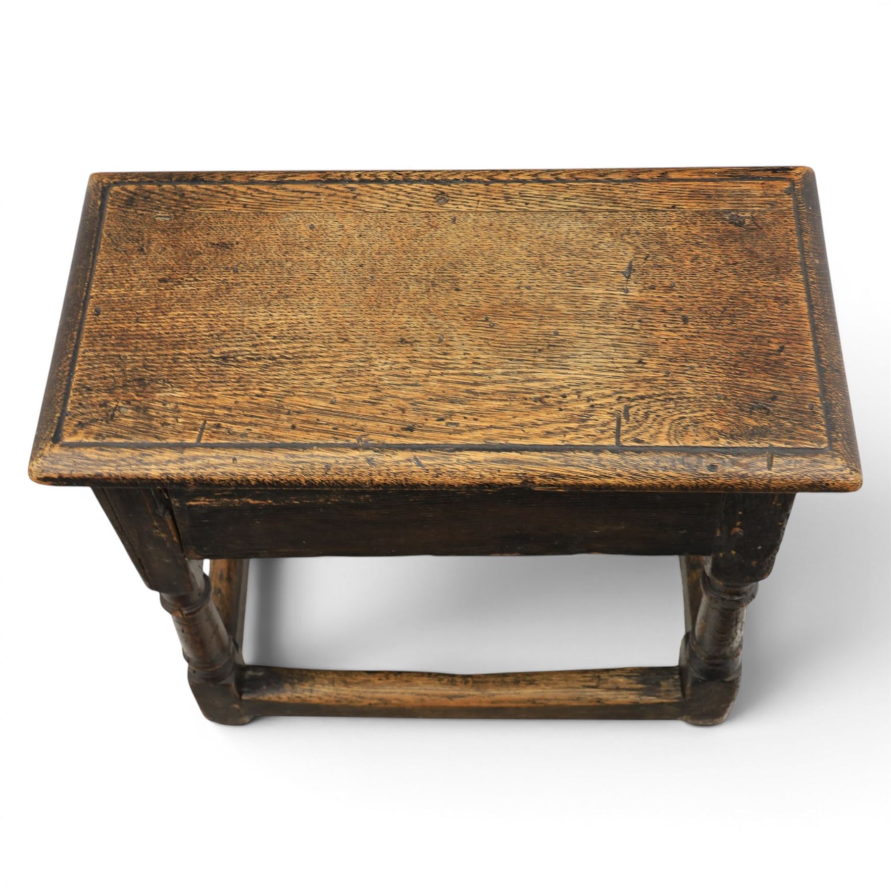 Two 19th century oak joint stools raised on turned supports united by stretchers
