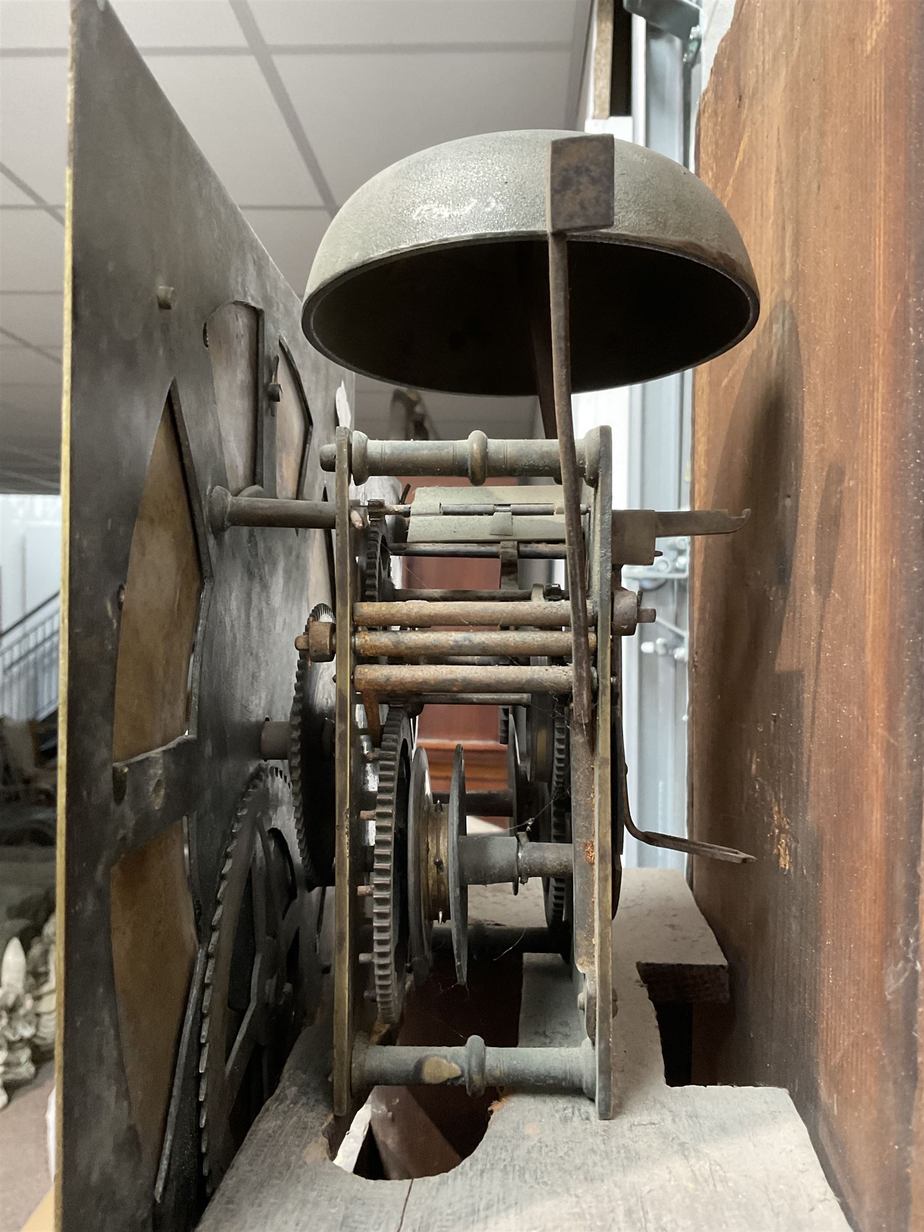 William Coulton of York - 18th century 30-hour ebonised longcase clock, with a flat pediment, broad cornice and plain frieze beneath,, square hood door with attached pillars, long break arch trunk door and rectangular plinth,  matted dial centre with curved date aperture and cast spandrels, chapter ring with Roman numerals, five minute Arabic's, minute and inner quarter hour tracks, count wheel striking movement striking the hours on a bell. With pendulum and weight.