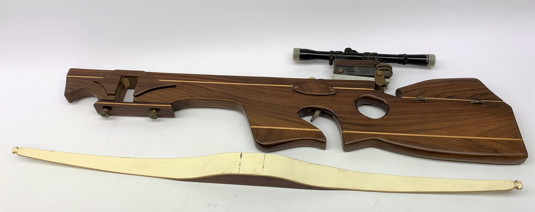 20th century crossbow with sectional mahogany shaped stock and Nikko Stirling telescopic sight L89cm; together with another similar with hinged foresight; and six arrows (8)