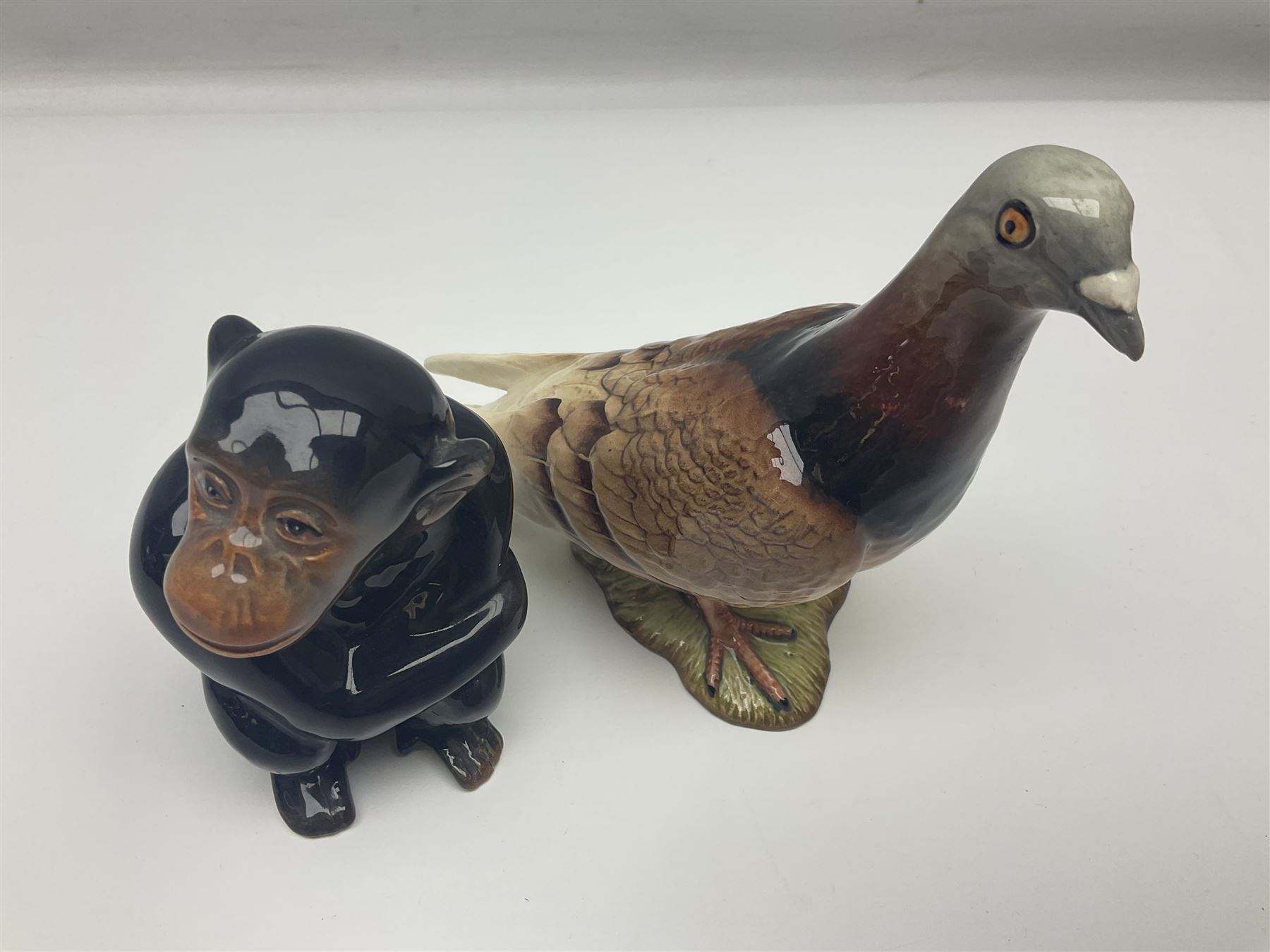 Large Sylvac monkey together with three smaller monkeys, together with Beswick Pigeon no 1383, Melba Ware hippo and baby and Royal Dux elephant 