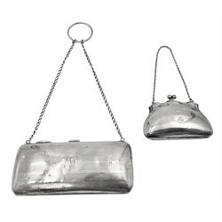 Early 20th century silver mounted coin purse, with leather interior and finger chain, hallmarked Samuel M Levi, Birmingham 1917, together with a similar Edwardian example, with engraved initials and engine turned decoration, hallmarked Birmingham 1907, maker's mark worn and indistinct, largest W11.3cm