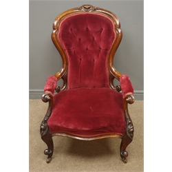  Victorian walnut framed open armchair, upholstered back seat and arms in red velvet, carved cresting rail and foliate cabriole legs, W68cm  
