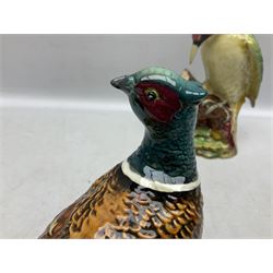Three Beswick figures of birds, comprising pheasant no 1225, magpie no 2305 and woodpecker 1218, all with impressed marks beneath, tallest H22cm