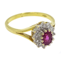  18ct gold oval ruby and round brilliant cut diamond cluster ring, hallmarked  