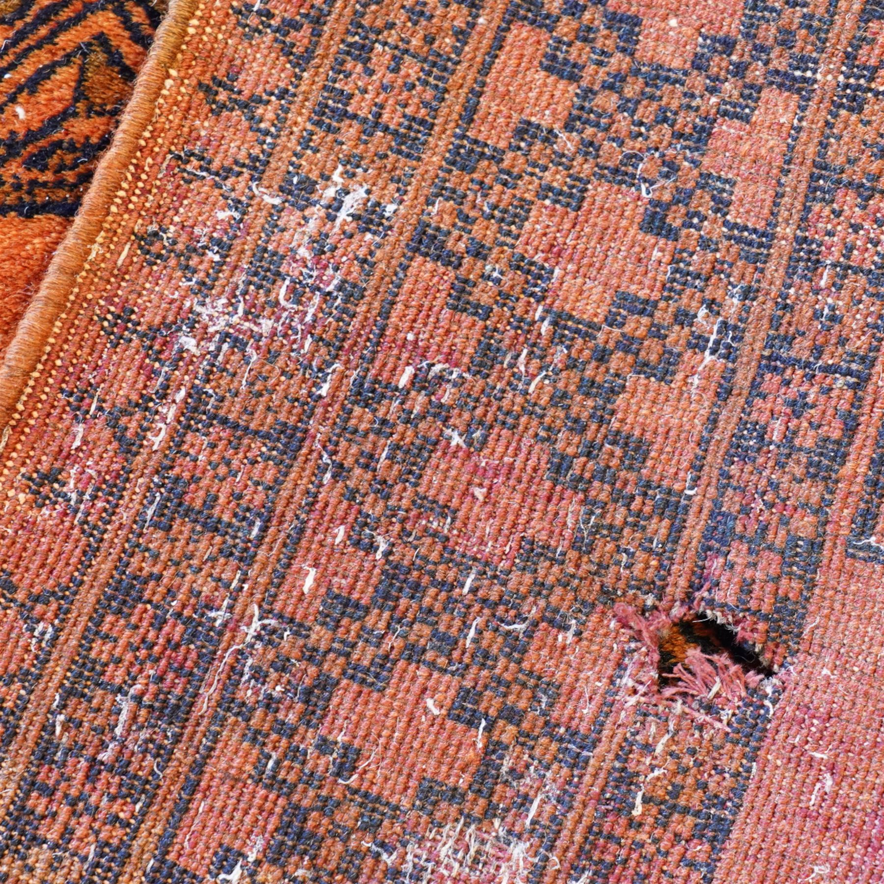 Persian Beluchi indigo ground prayer rug, overall geometric design (147cm x 85cm); together with a Bokhara rust ground rug (146cm x 101cm)
