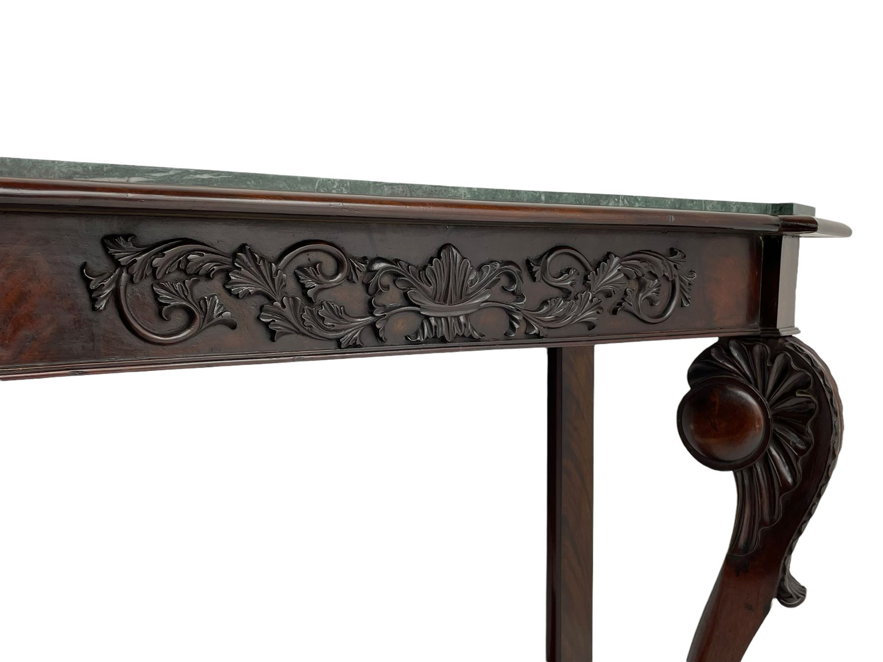 19th century Irish mahogany console table, with green canted marble top and figured frieze with carved scrolled foliage mount, acanthus carved cabriole supports with claw feet and shaped moulded plinth