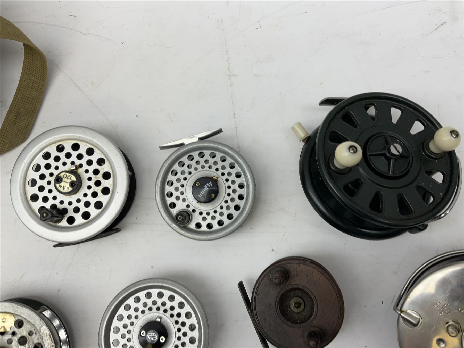 Fishing tackle, including 'The Gnat' fly reel, Alvey 4 1/2 inch reel, Paramount 4 1/2 inch reel, other fishing reels, various fishing flies and other similar items in a carry bag 