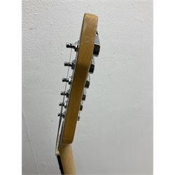 Stagg heavy metal style six-string electric guitar, finished in black with chrome tuning pegs, fret markers and humbucker pickups to bridge L106cm; and Hondo USA electric guitar with black body, ivory coloured pickguard and mother-of-pearl fretmarkers L101cm (2)   