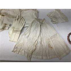 Late 18th century sampler worked with the alphabet above verses in red, by Mary Birkett aged 10 November 16th 1792, H33.5cm W34.5cm, together with another sampler worked with the alphabet above Proverbs 14:23, by Mary Anne Hainworth, Chesham, date unknown (--83), both in glazed frames, together with a quantity of Victorian and later dolls clothes to include lace examples