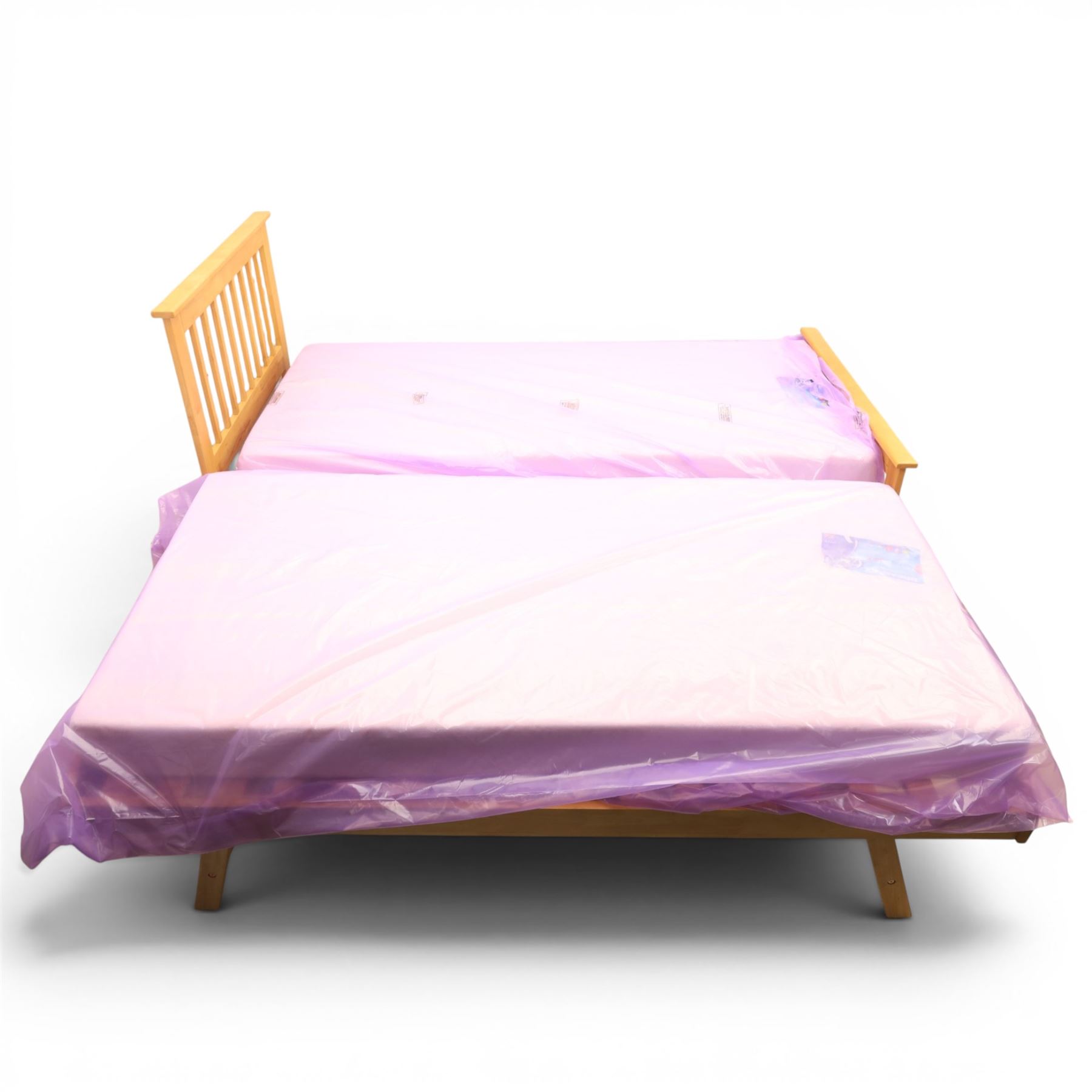 Contemporary light oak trundle bed, slatted headboard and footboard,  incorporating pull-out trundle bed on castors, complete with two memory foam mattresses