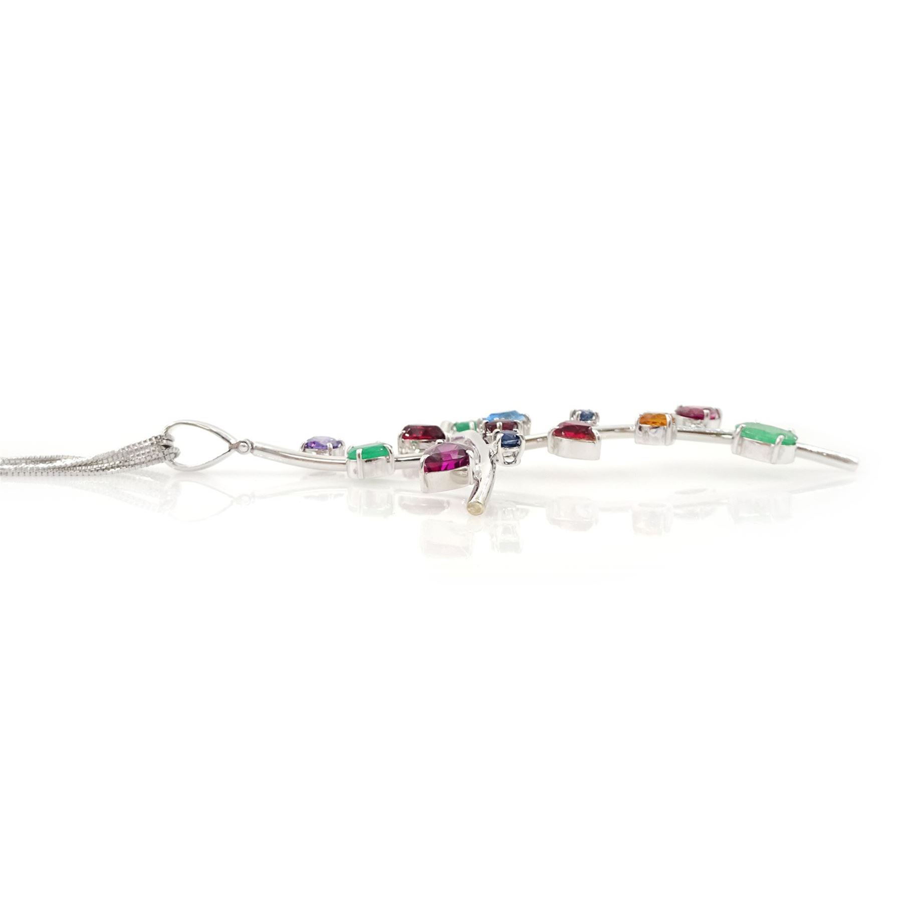 18ct white gold multi gemstone cross pendant necklace, vari-cut stones including emerald, ruby, pink and blue sapphire, red and blue stones, on a four strand box link chain necklace, stamped 750