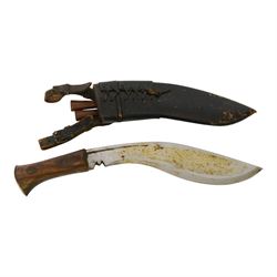 Two WWII Kukri knives, wooden grip with brass cap to pommel, single edged curved blade, within leather scabbard with belt attachments, overall L40cm 