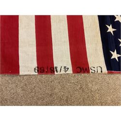 Vietnam War; two North Vietnamese military flags, together with a United States Marine Corps Vietnam period stars and stripes flag 