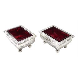 Pair George III silver rectangular baluster salts with cast acanthus folded rims and original cranberry glass liners by Thomas Radcliffe, London 1805, approx. 7oz