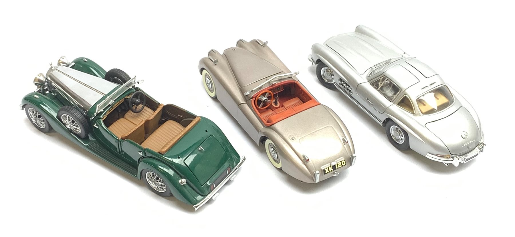 Two Franklin Mint die-cast models comprising 1938 Alvis 4.3 litre and 1954 Mercedes Benz 300SL, both boxed with paperwork; together with a Danbury Mint die-cast model of a 1949 Jaguar XK120, boxed (3)
