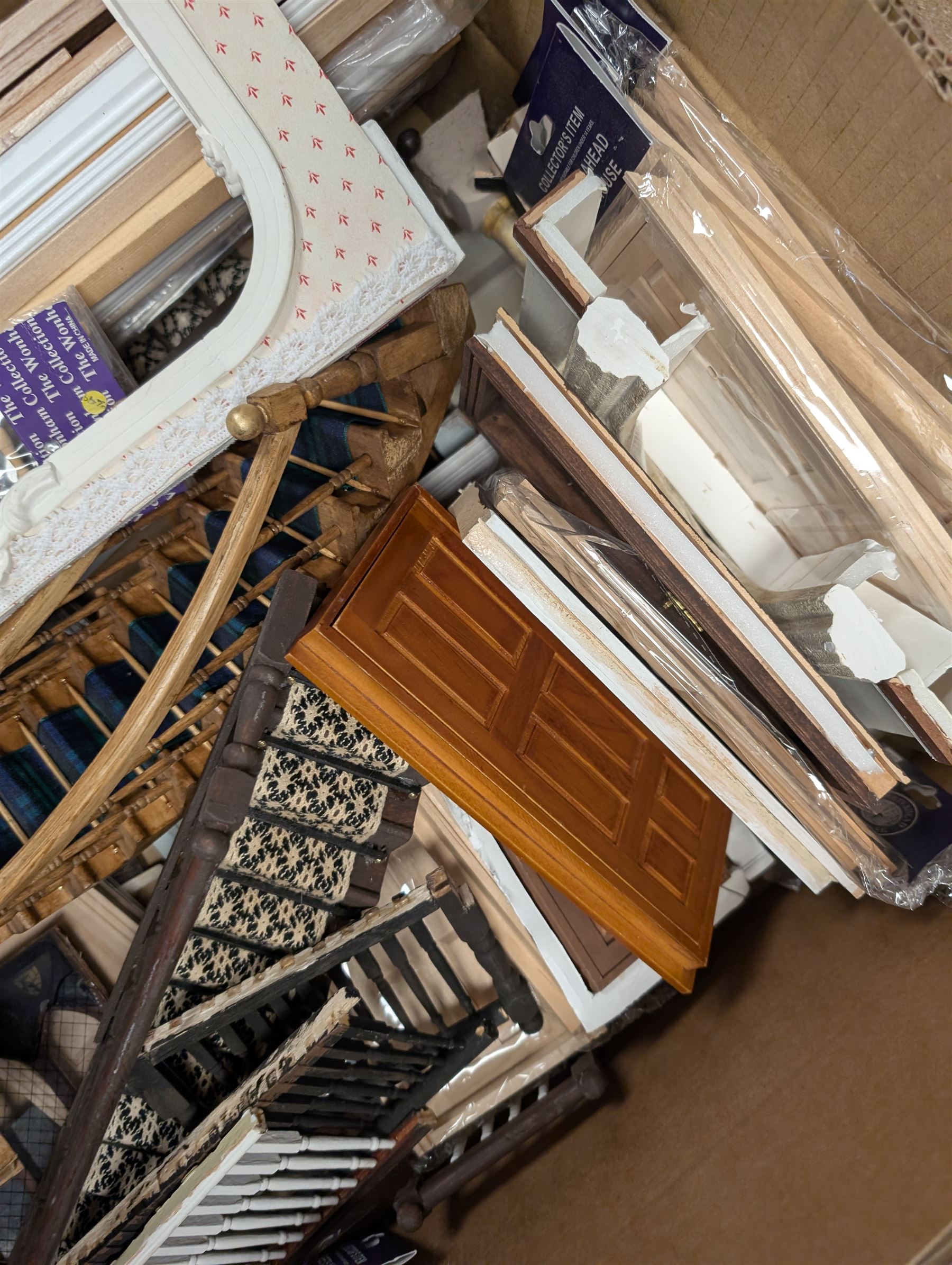 Dolls House building accessories, including three stair cases, a quantity of doors and windows, skirting board, coving, kitchen and fireplaces scenes and a collection of wired and non wired light fittings