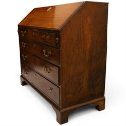 George III mahogany bureau of large proportions, the fall-front enclosing fitted interior with fluted column secret compartments and assorted pigeonholes and correspondence drawers flanking central cupboard, over four graduating cock-beaded drawers with original brass swan-neck handles, raised on bracket feet