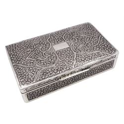 Indian silver cigarette box, of rectangular form with chassed and embossed foliate decoration and vacant rectangular panel to hinged cover, opening to reveal softwood lined interior with division, H3.3cm W14.3cm D8.5cm, stamped Silver VR Co with elephant mark