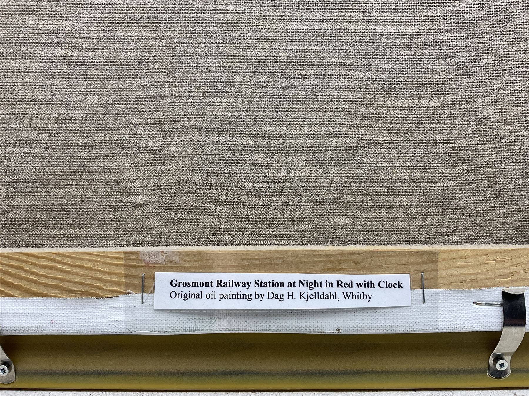 Dag Hagenaes Kjelldahl (Norwegian/Whitby Contemporary): 'Grosmont Railway Station at Night in Red with Clock', oil on canvas signed and dated 2004, 30cm x 40cm