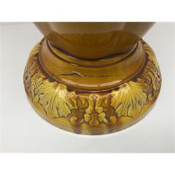 Bretby Jardiniere and stand, with foliate and foliage decoration with a red and yellow ground, impressed mark beneath H94cm