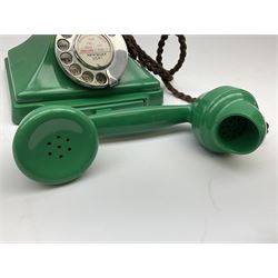Jade green Bakelite telephone, of pyramid form with rotary alphabet dial, brown braided handset cord and a base draw, W18cm D14cm H15cm