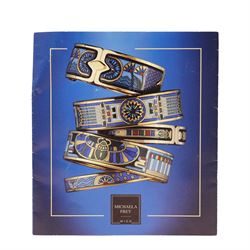 Michaela Frey gold plated and enamel suite of jewellery from the Greco-Roman collection, including a pair of oval stud earrings, hinged bangle and pendant on multistrand rope necklace, all boxed