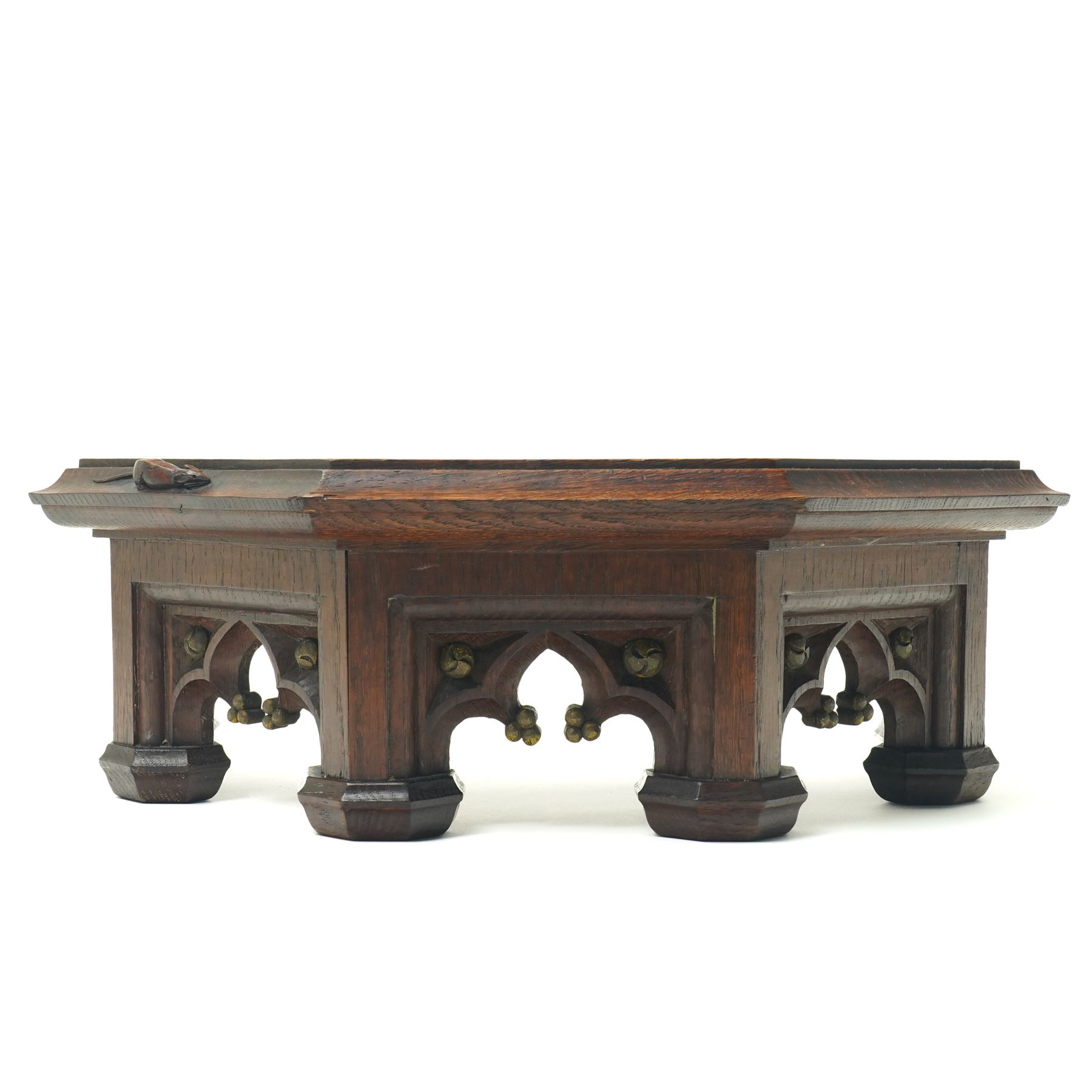 Mouseman - circa 1930s oak wedge shaped six sided plinth, of gothic design with carved berries and columnar supports, with carved mouse signature, by Robert Thompson of Kilburn
