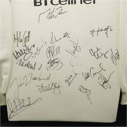 2000 England Rugby shirt sponsored by BT Cellnet, with 20 signatures from various England players, to include Martin Johnson, Mike Catt, Charlie Hodgson, Will Greenwood, Jason Leonard, and others, framed and glazed, overall 106cm x 95cm 