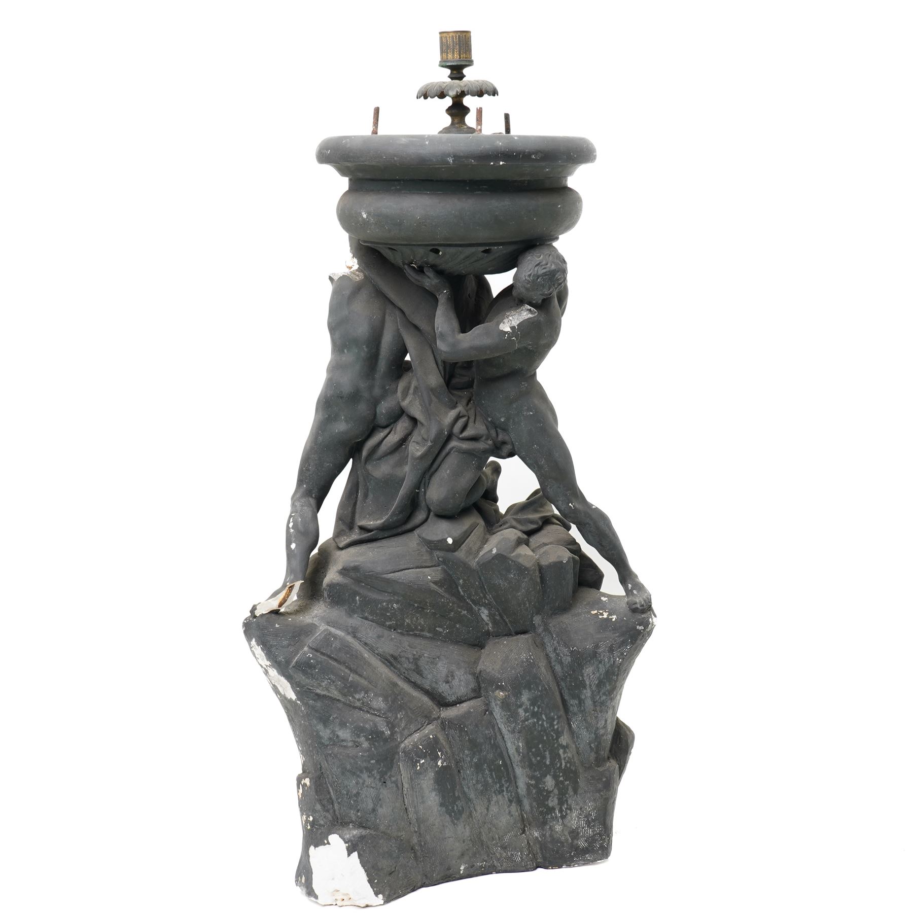 Neoclassical 19th century plaster pedestal, the base cast as two straining Atlantes on a naturalistic rocky base, unmarked, excluding fittings H65cm; together with a set of three plaster figures, cast as Egyptian ladies in headdresses and draped in cloth, by John Dominic Giannelli (1775-1841), the reverse with hieroglyphic decoration, inscribed 'Published as the Act Directed By J D Giannelli 1805', possibly corresponding attachments for the aforementioned pedestal, H62cm 
Provenance: property of a Nobleman